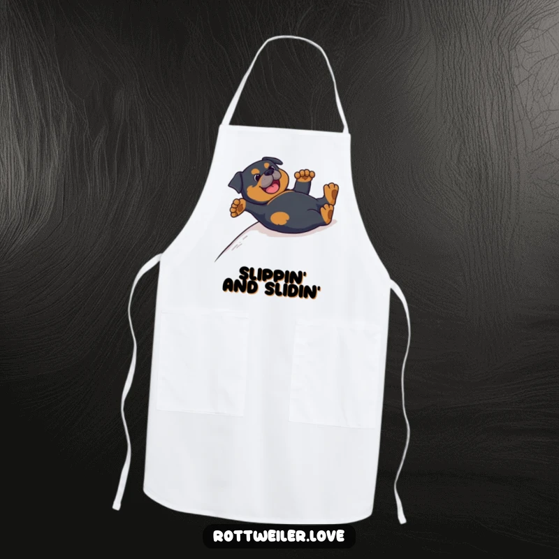 Funny Rottweiler apron adorned with a dog sliding on its back, paws up, bringing humor to the kitchen.
