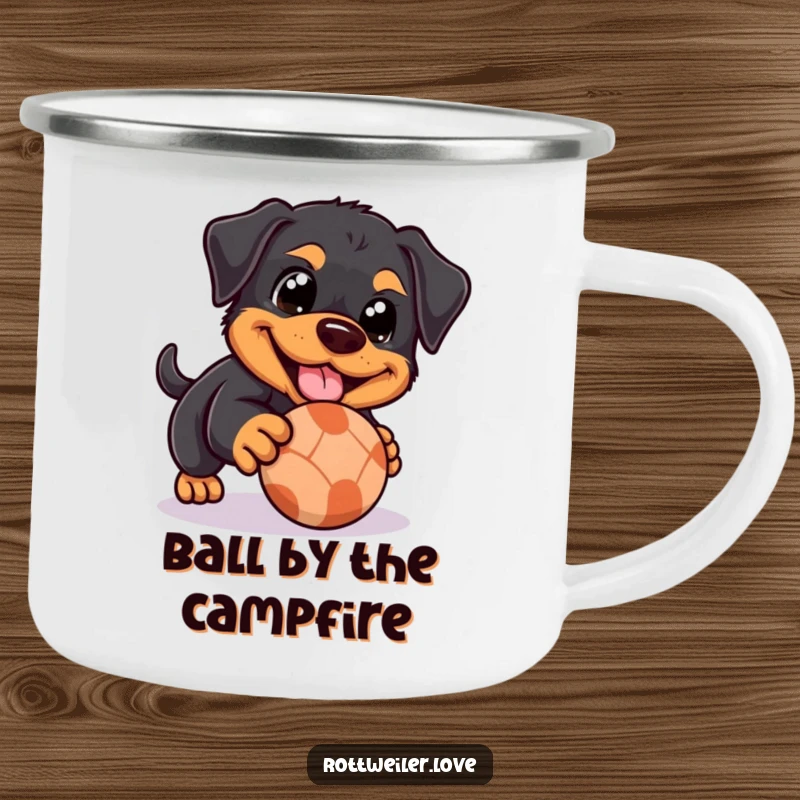Funny Rottweiler camping mug showing a dog with happy eyes playfully nudging a rolling ball, perfect for enjoying the outdoors with a smile.