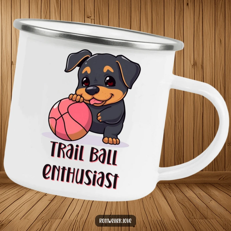 Funny Rottweiler camping mug featuring a dog playfully nudging a large, bouncy ball, perfect for rugged adventures and a dose of humor.