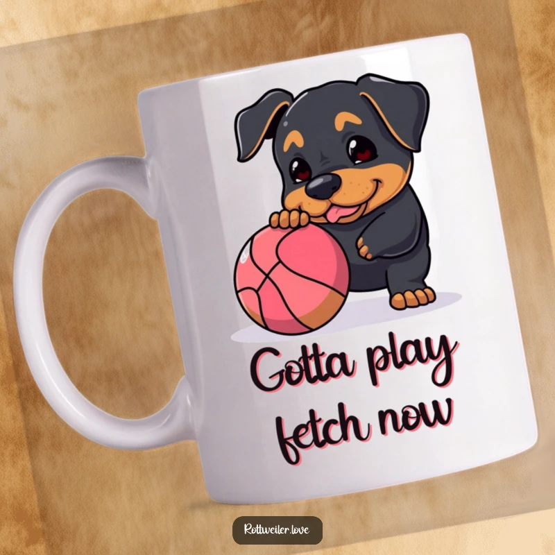 Funny Rottweiler mug depicting a happy dog playfully nudging a large, bouncy ball, full of energy and interactive fun.