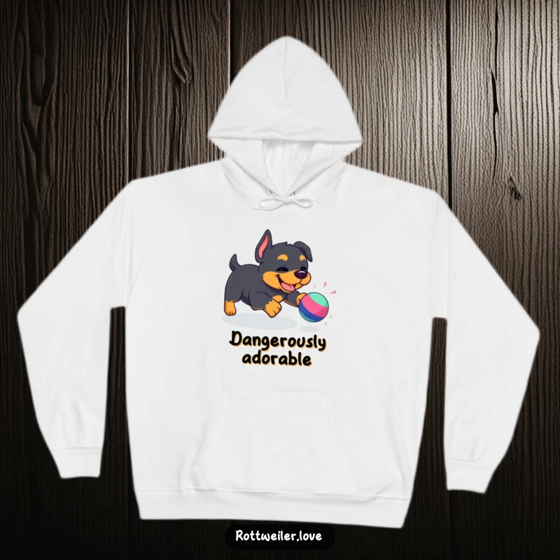 Funny Kawaii Rottweiler hoodie featuring an energetic dog enthusiastically chasing a toy, radiating pure, unadulterated fun and adorable excitement.