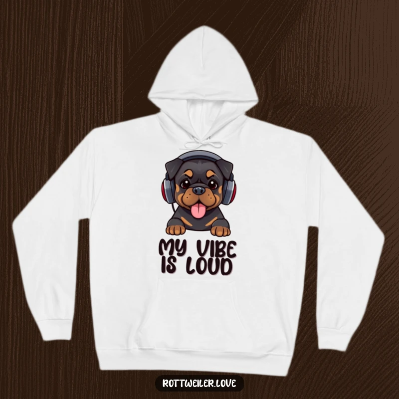 Funny hoodie featuring a Rottweiler wearing oversized headphones and bopping its head, offering warm comfort and humorous musical vibes.