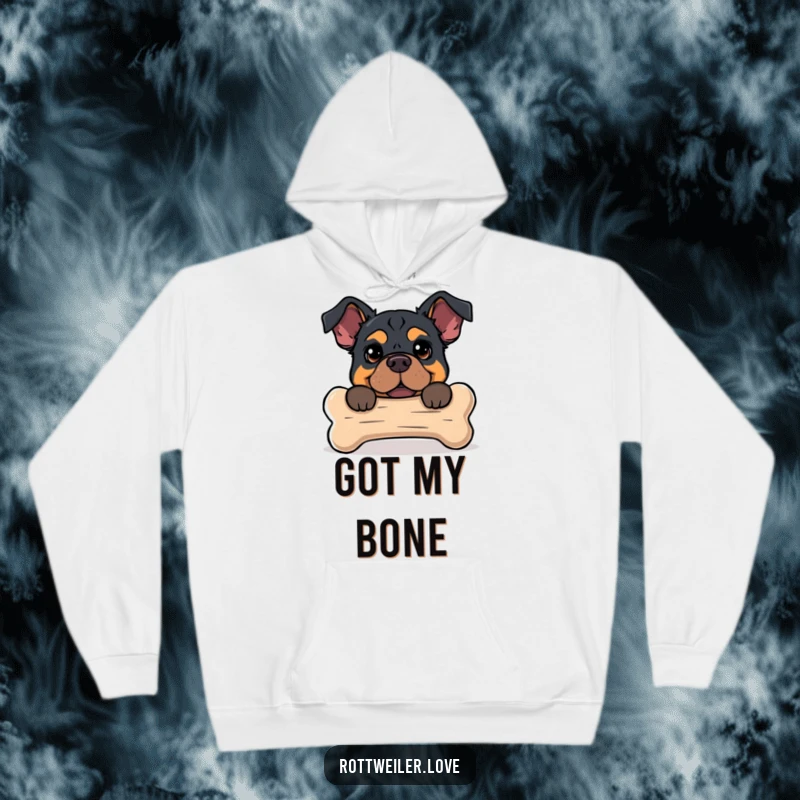 Funny hoodie featuring a Rottweiler peeking from behind a large dog bone, offering a warm and humorous design.