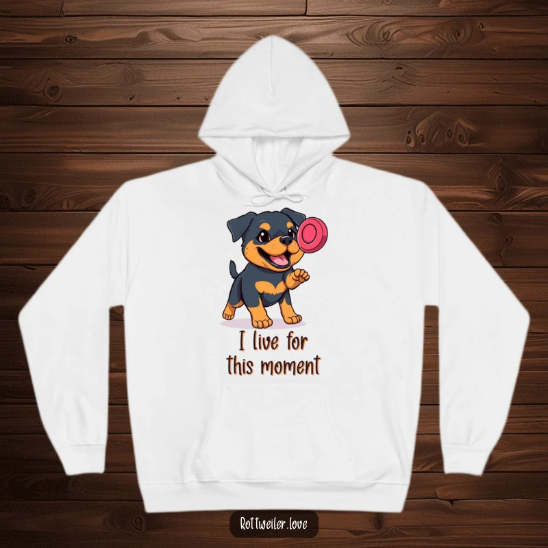 Funny Rottweiler hoodie showing a dog jumping high to snag a frisbee, a perfect blend of warmth and hilarious action.