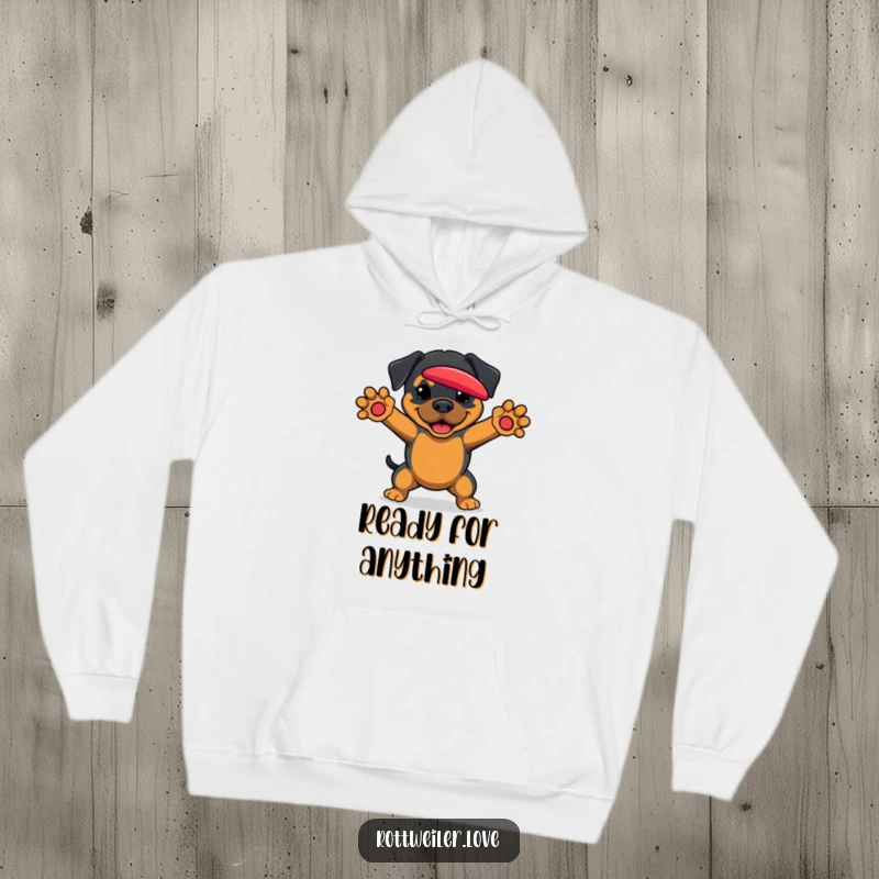 Funny Rottweiler Hoodie depicting a dog poised to catch a frisbee, ready for action and cozy comfort.