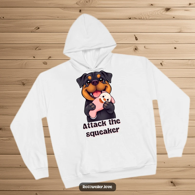 Funny Rottweiler hoodie displaying a dog with a wide, happy smile holding a floppy squeaky toy, symbolizing playfulness and warmth for screen readers.