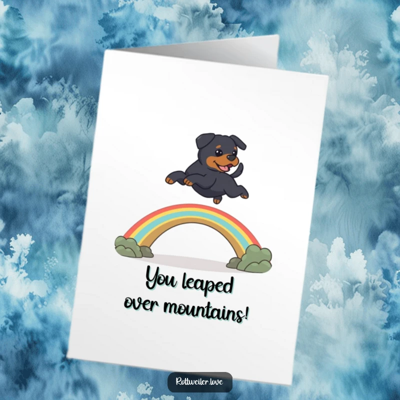 Funny Free Printable Rottweiler Congratulations Card: A happy Rottweiler leaps over a rainbow bridge, signifying a successful journey.