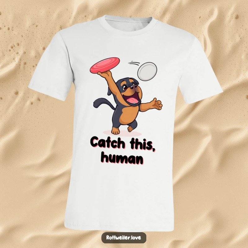 Funny Rottweiler t-shirt showing an energetic dog enthusiastically jumping to catch a flying disc, perfect for showcasing a love of sports.