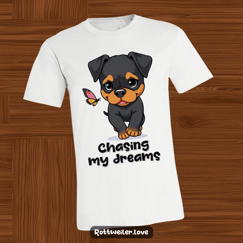 Funny Rottweiler t-shirt featuring a dog with intense determination, focused on the thrilling chase of a fluttering butterfly.