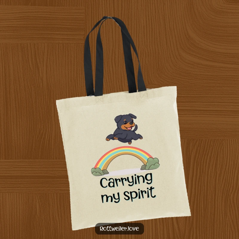 Funny Rottweiler dog leaping over a rainbow bridge, featuring heartwarming pet memorial humor on this tote bag.