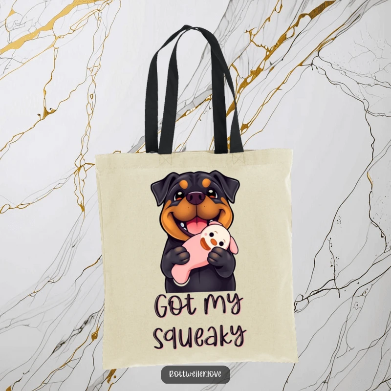 Funny Rottweiler tote bag with a smiling dog holding a floppy squeaky toy, highlighting a joyful and practical accessory for dog enthusiasts.